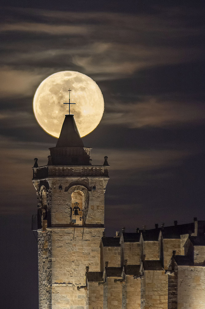 Full Moon behind the belltower of Menorca's Cathedral (Spain) by Josep Benejam Enrich