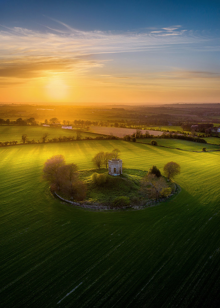 Sunrise over The Caddell's Folly in Naul (Meath, Ireland) by Trevor Owen