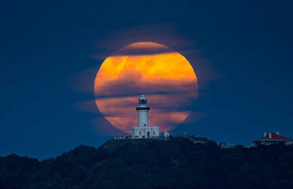 Full Moon rising behind Cape Byron Lighthouse at Byron Bay (New South Wales, Australia) by Bob Charlton