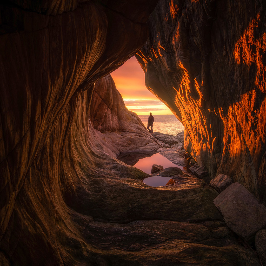 Man shot from a cave during the last Sunrise of 2019 in Nynäshamn (Sweden) by Philip Slotte