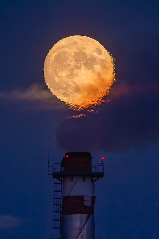 Full Moon over an industrial chimney in Spain by Jesús Manzaneque