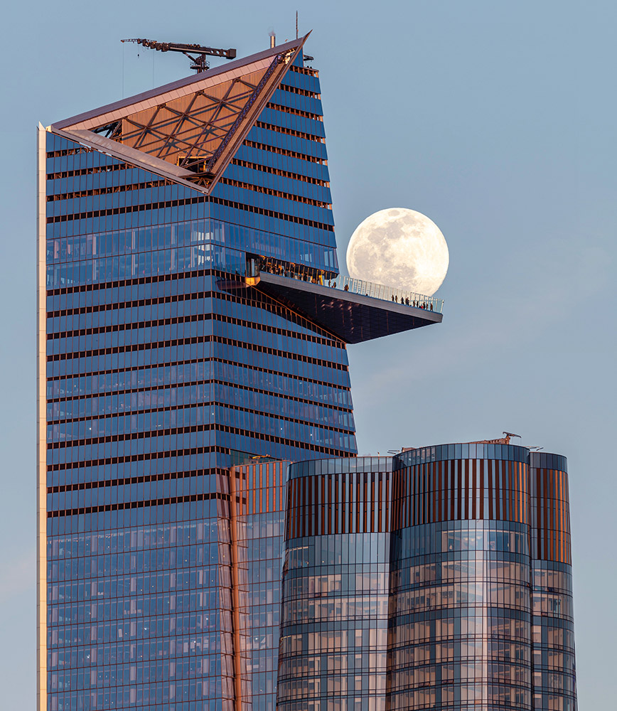 Full Moon behind the Edge NYC sky deck in New York City (USA) by Jeff Casey