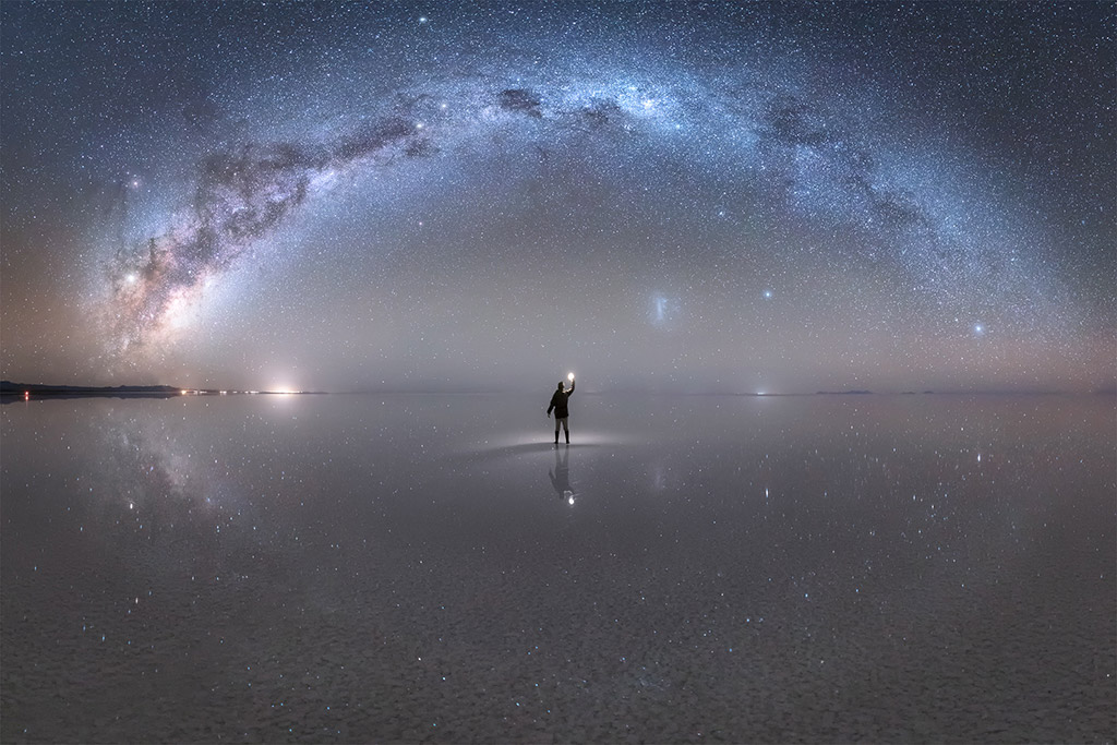 Man over the Milky Way reflected on the Salar de Uyuni (Bolivia) by Jheison Huerta